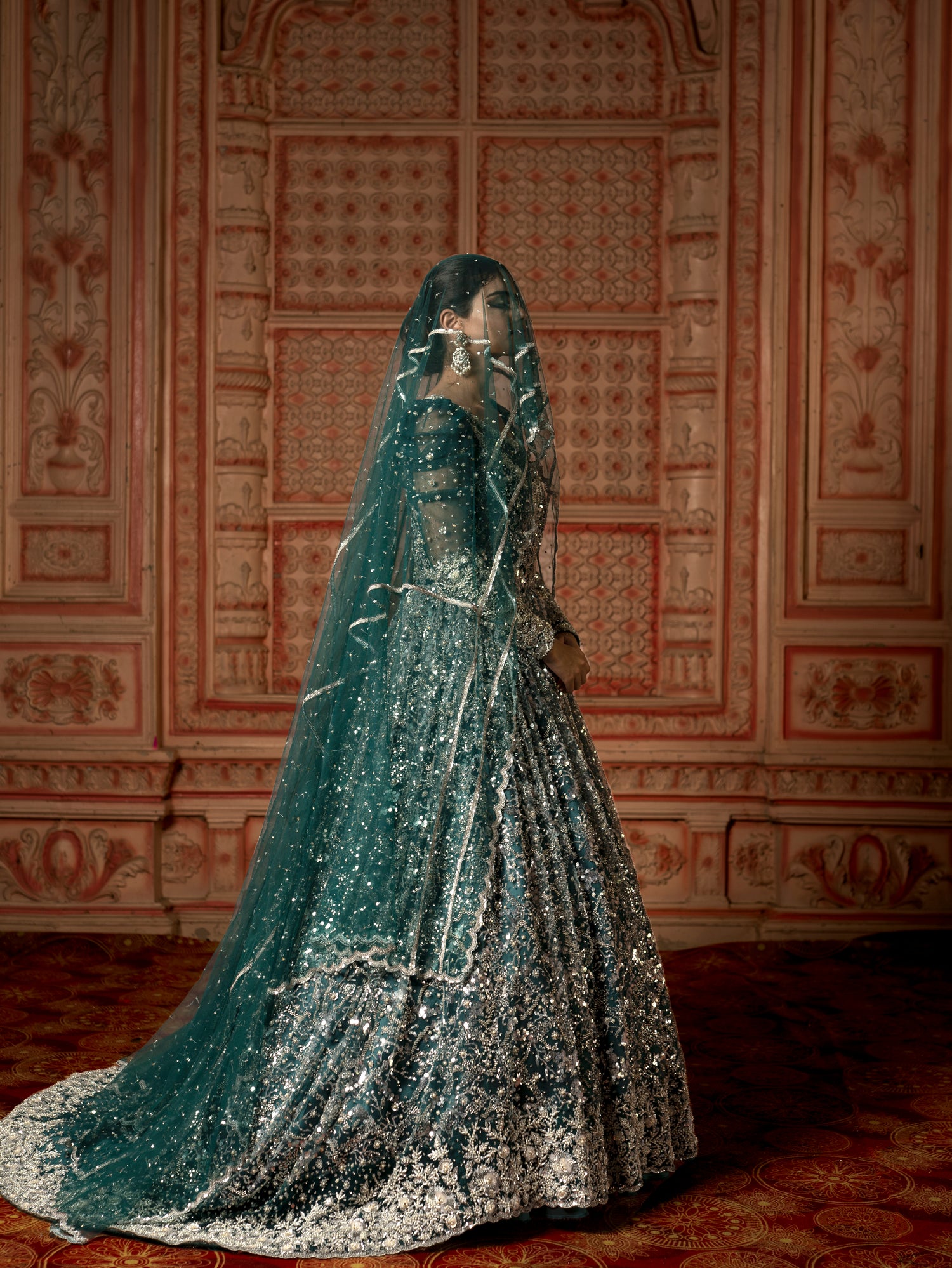 Emerald green sequin trail gown.